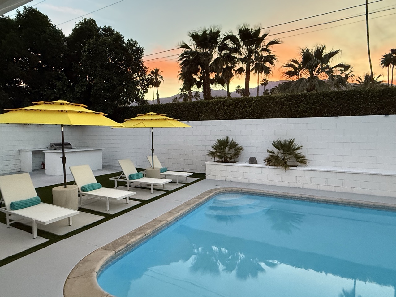 Poolside umbrella at sunset